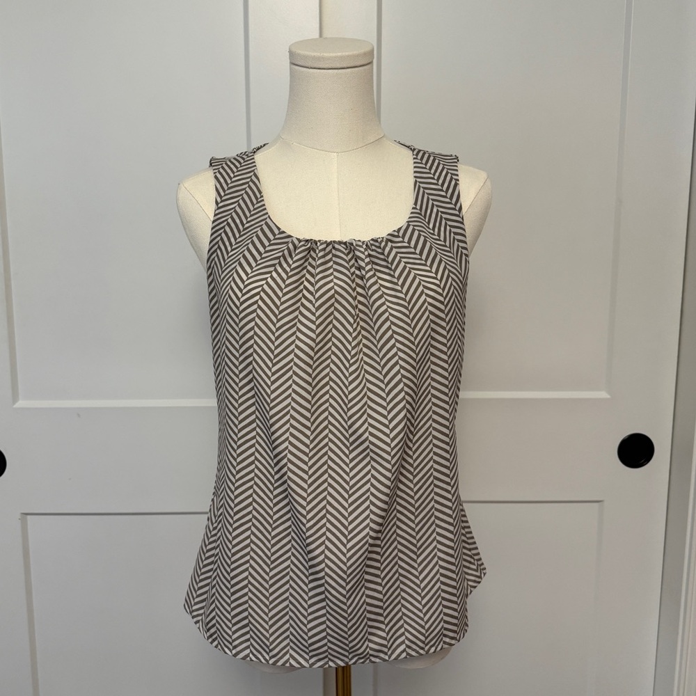 Black and white zig-zag patterned sleeveless blouse